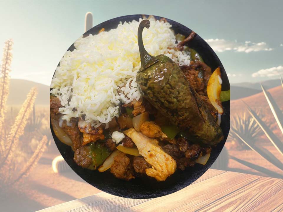 A colorful grilled meat and vegetable entrée with rice and a roasted pepper