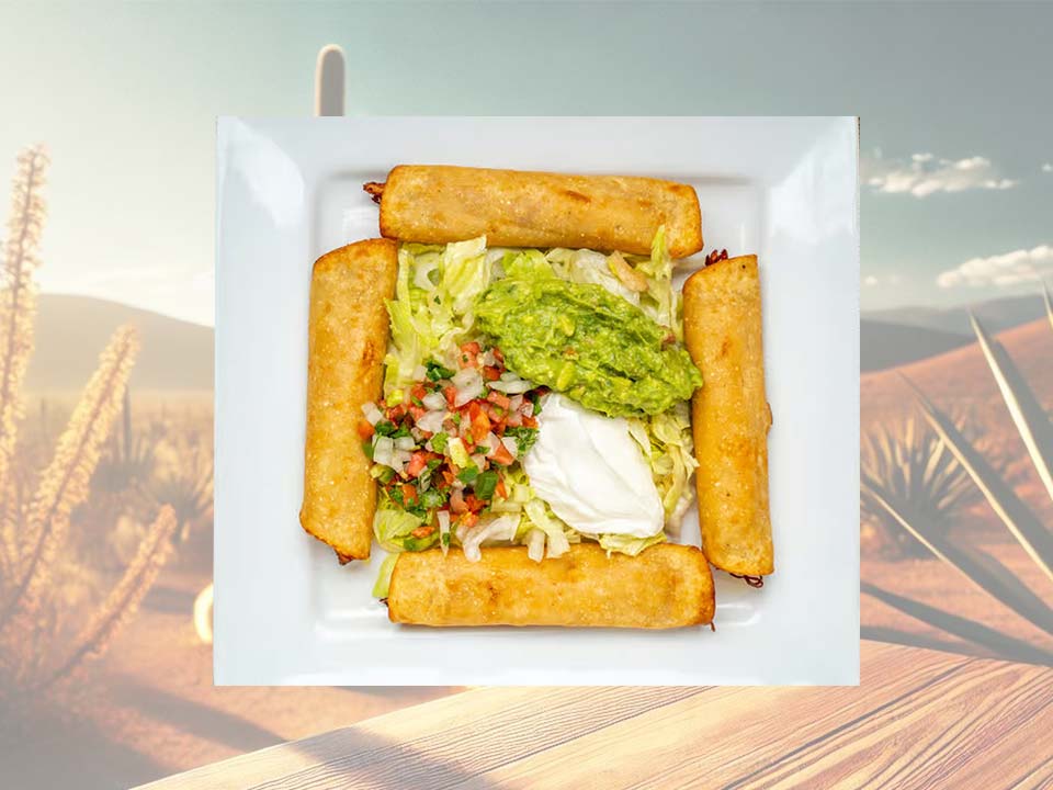 Four golden taquitos with guacamole, sour cream, lettuce, and pico de gallo